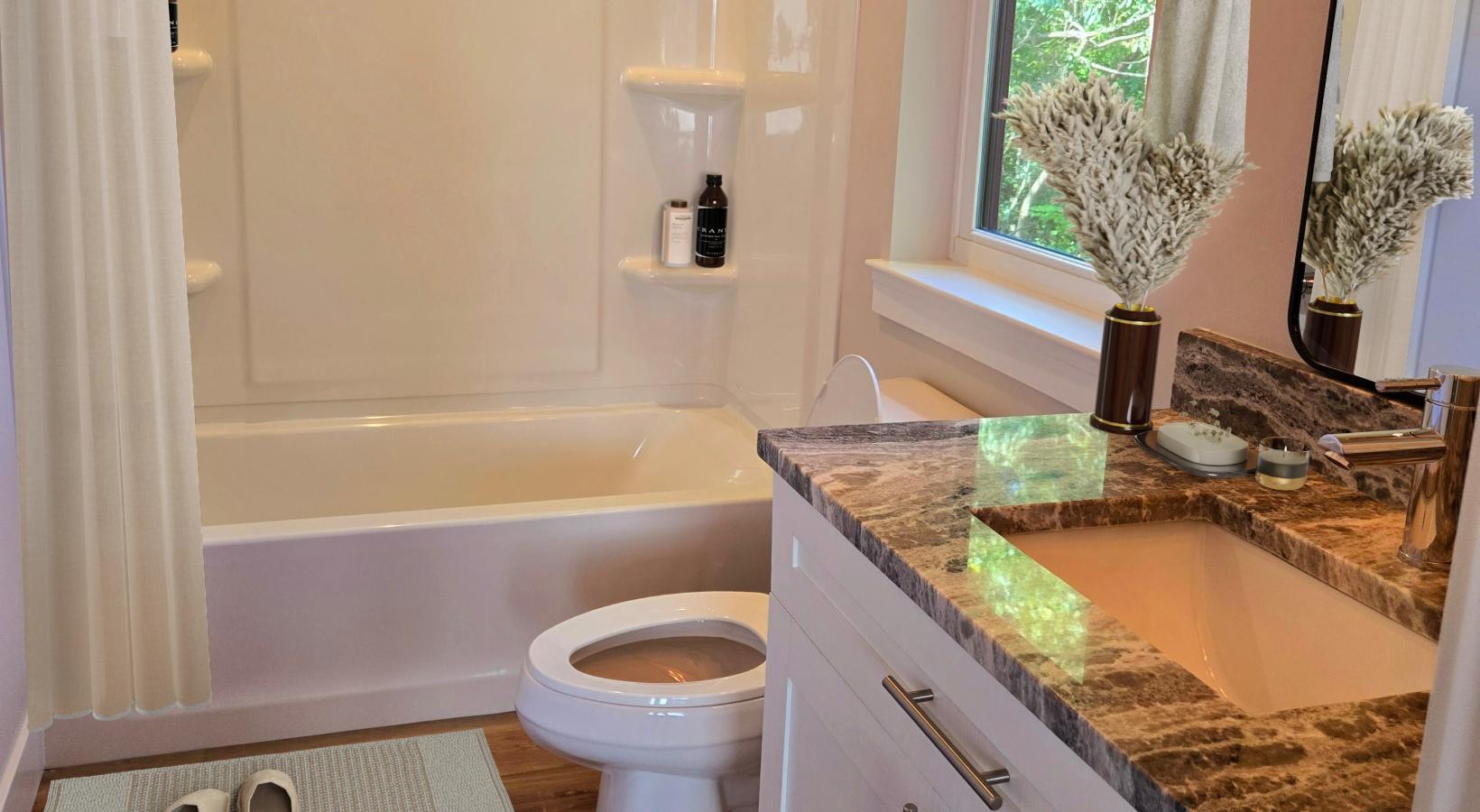 Bathroom options with thoughtful details a bathroom with a tub sink and toilet