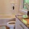 a bathroom with a tub sink and toilet