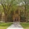 a large building with trees in front of it