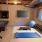 a room with a weights pool table and a tv