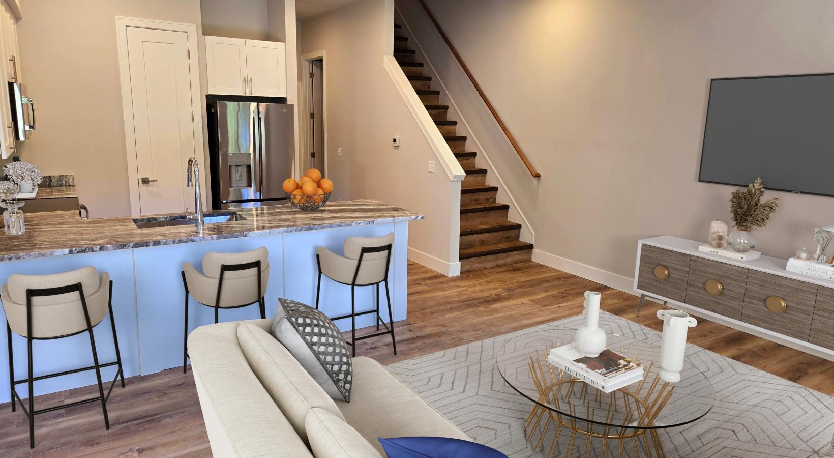 Spacious kitchens with thoughtful details a living room with a bar and a couch