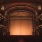 a theater with a stage and chairs